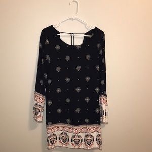 Navy, long sleeved dress with flared sleeves.